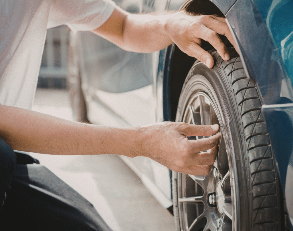 Vehicle owner checks the tire pressure of their tires.